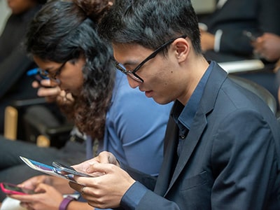 Students looking at their phones