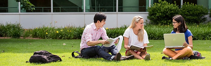 Students studying outside of the Ford Environmental Science & Technology campus building