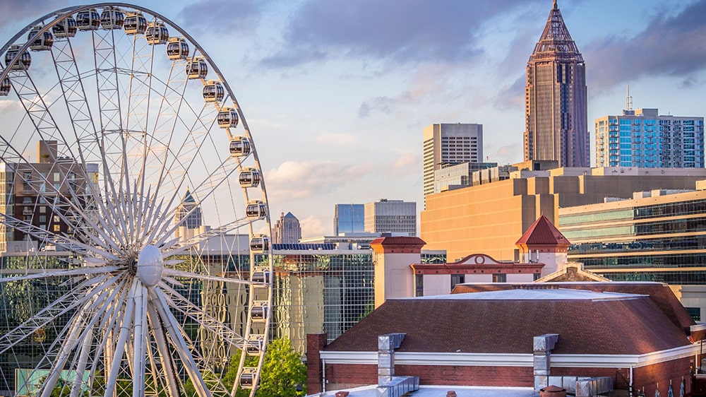 Ferris wheel amid Atlanta skyline