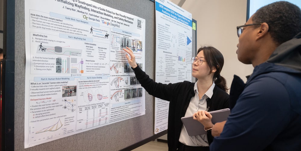 Graduate student presenting research at CRIDC poster session