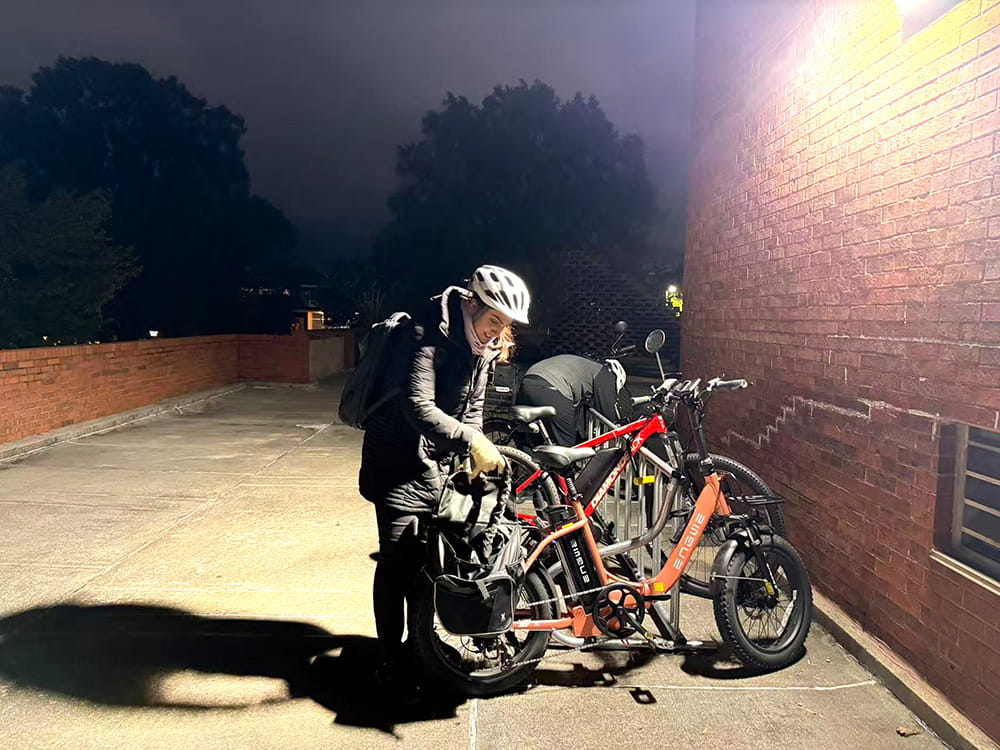Grad student using bike at night